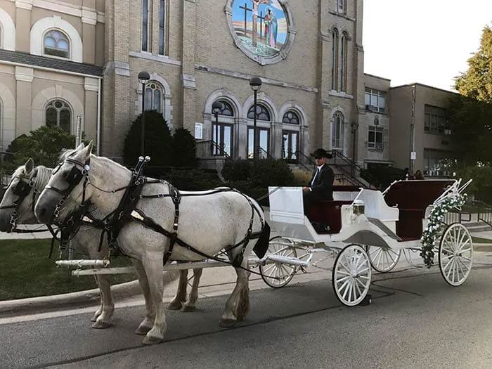 A classic horse drawn carriage on the street in Woodstock